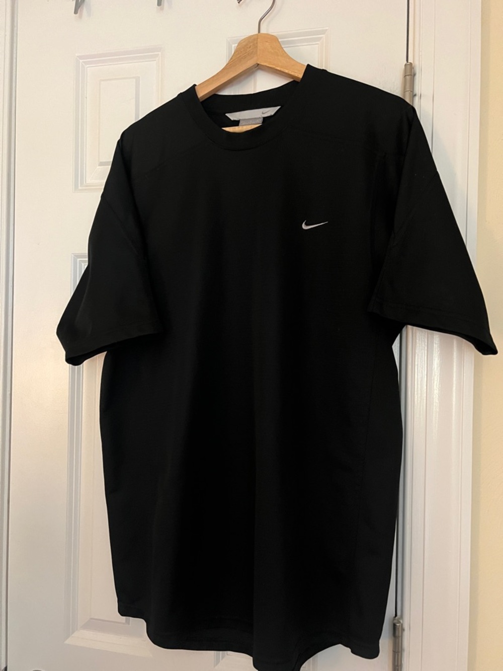 Nike Black Short Sleeve Athletic Shirt with White embroidered Swoosh